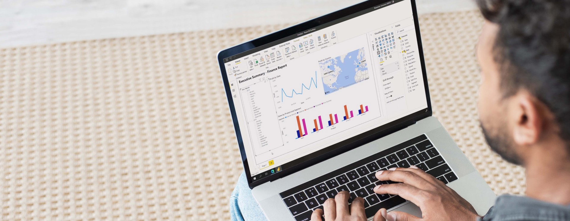 Person arbetar på laptop med dataanalys i Power BI med dashboards, diagram och KPI:er för beslutsstöd i affärssystem