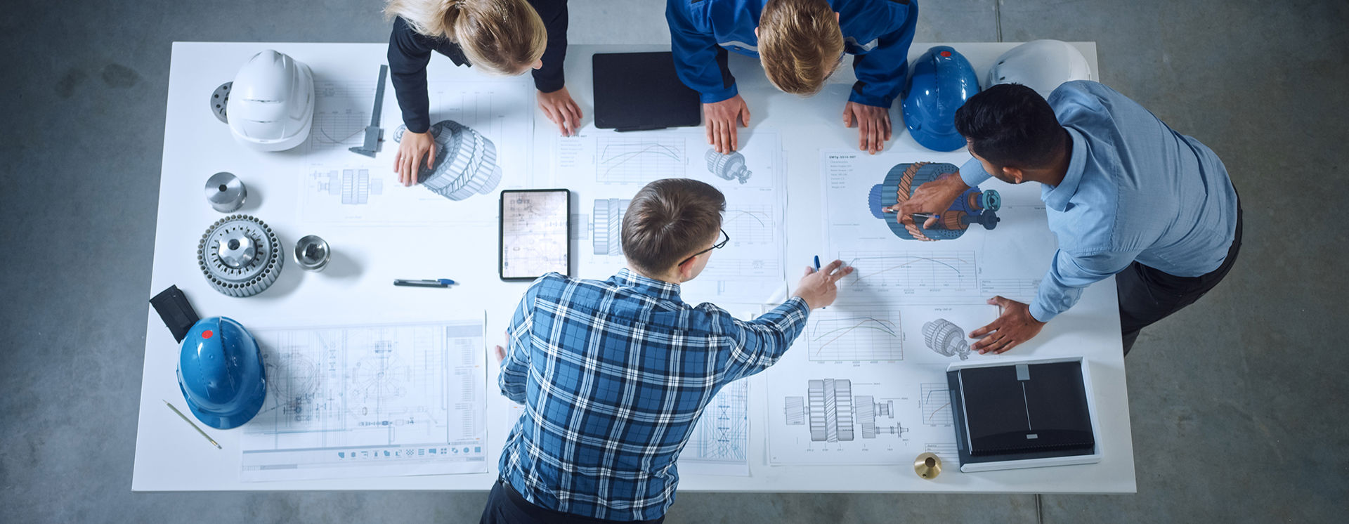 Stock Photo Team Of Industrial Engineers Lean On Office Table Analyze Machinery Blueprints Architectural 1902078616